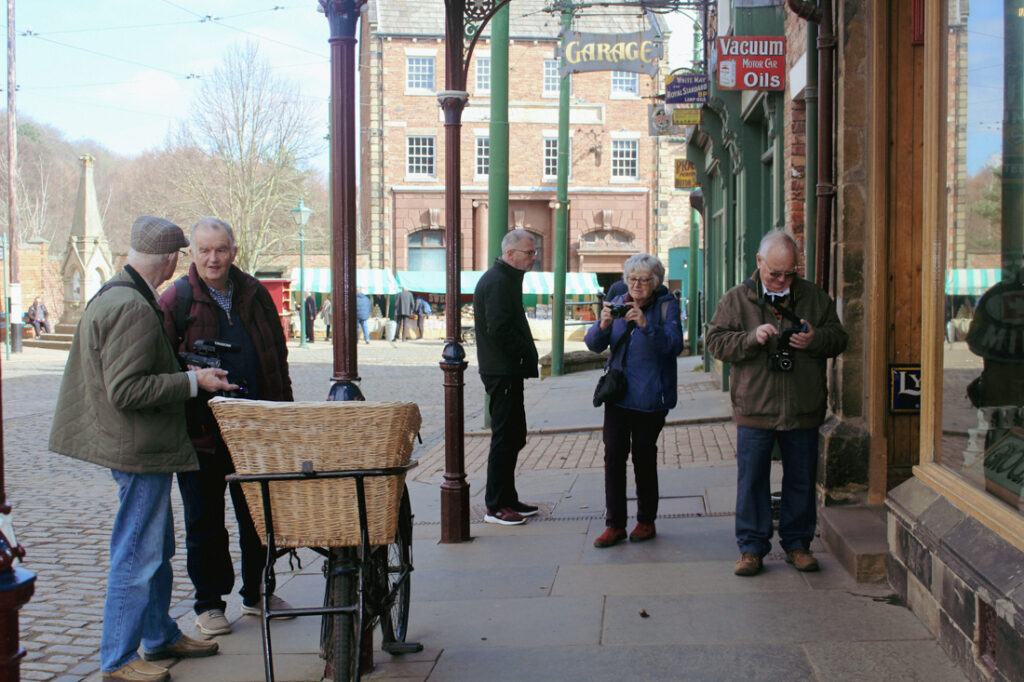 A group of photographers chatting and taking photos at Beamish.