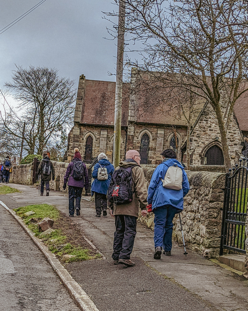Walkers passing church